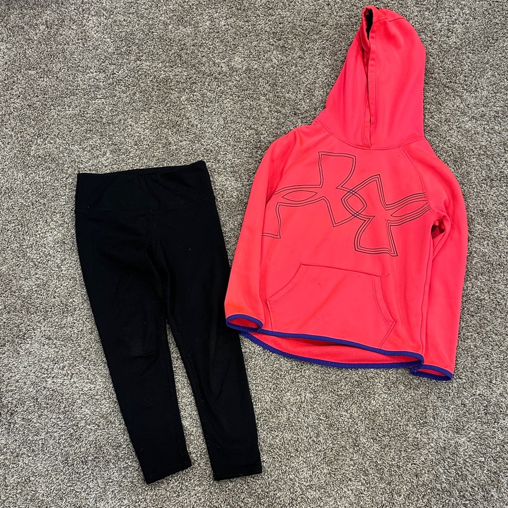 UA pink hoodie with  black athletic leggings